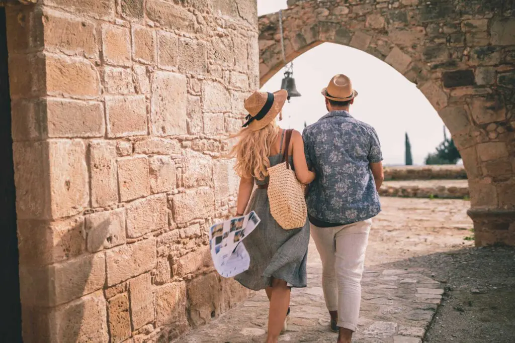 A man and woman walking down the street.