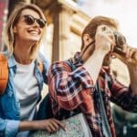 A man and woman taking pictures of each other.