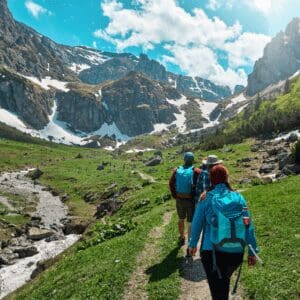 A group of people walking up a hill