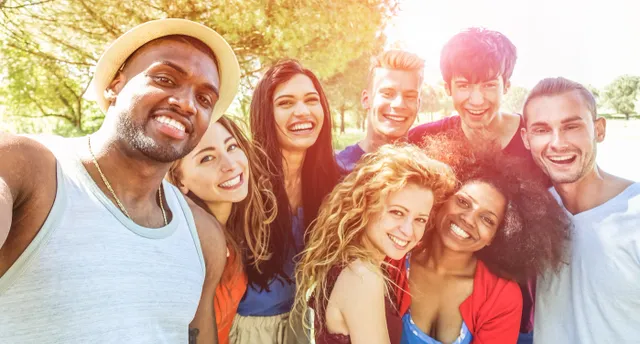 A group of people that are smiling for the camera